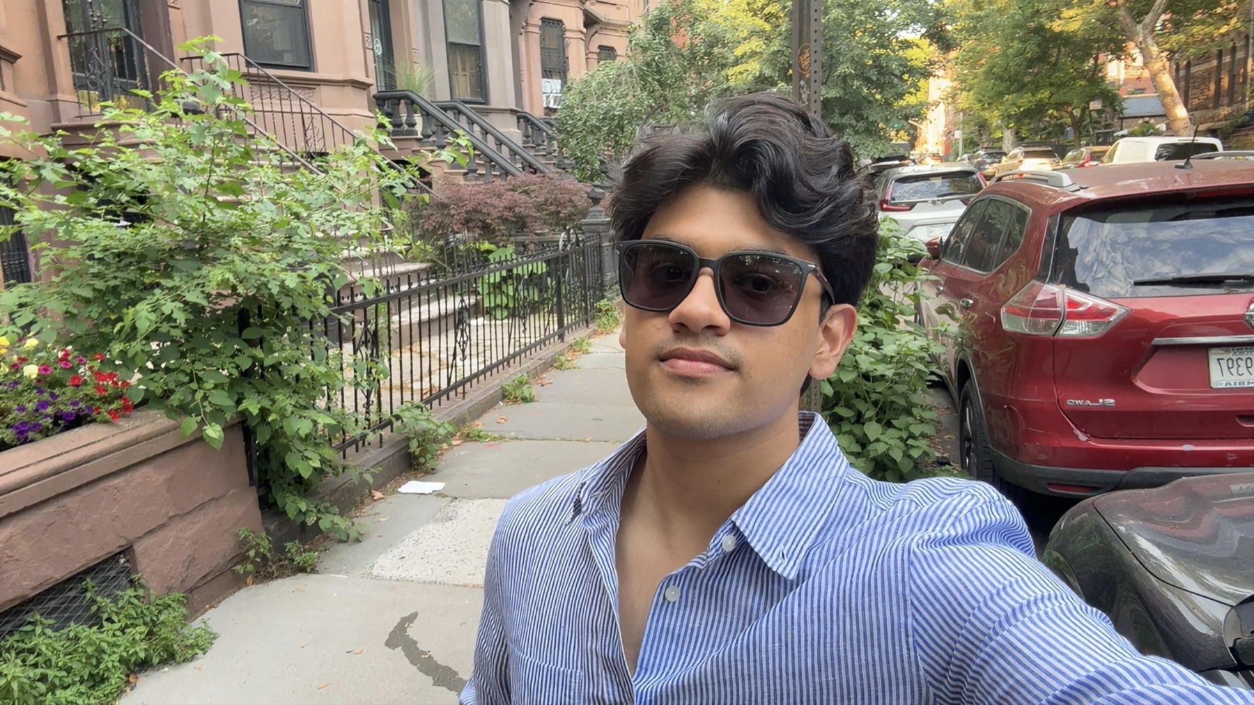 Siddhant Yadav on a tree-lined street in New York